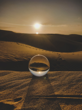 Clear Ball on Brown Sand Dunes Clear Ball on Brown Sand Dunes
