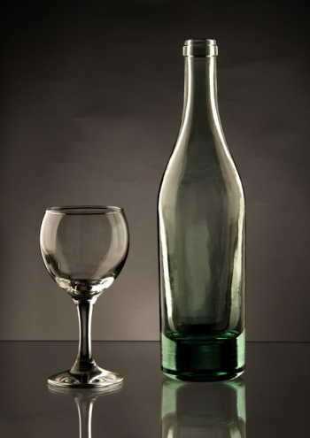 Clear Glass Bottle Beside Wine Glass Clear Glass Bottle Beside Wine Glass
