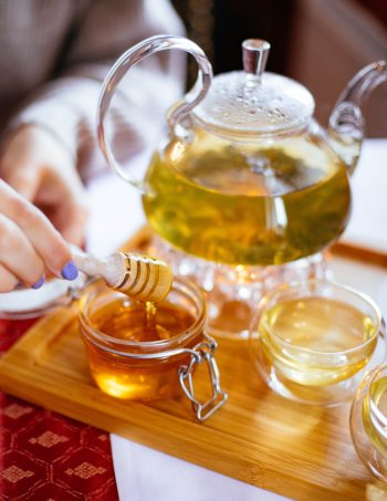 Clear Glass Cup Filled With Honey Clear Glass Cup Filled With Honey