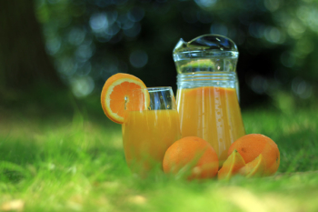 Clear Glass Cup Filled With Orange Juice Clear Glass Cup Filled With Orange Juice