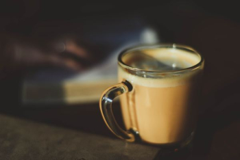 clear glass mug filled with brown liquid clear glass mug filled with brown liquid