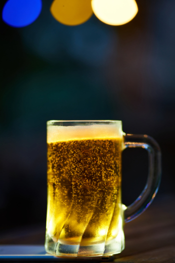 Clear Glass Mug Filled With Yellow Liquid Clear Glass Mug Filled With Yellow Liquid