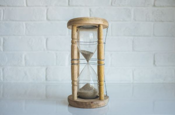 clear hour glass with brown frame clear hour glass with brown frame