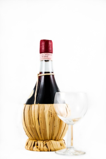 Clear Wine Glass Beside Red Wine Bottle Clear Wine Glass Beside Red Wine Bottle