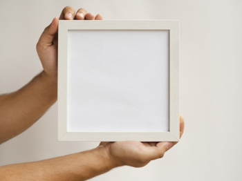 Close-up hands holding a frame mock-up Free Photo