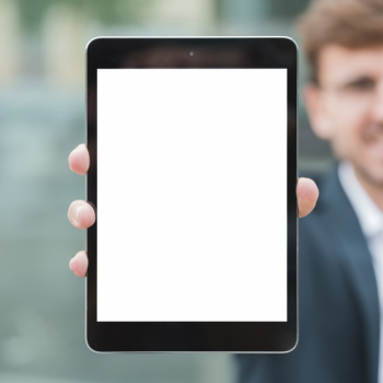 Close-up of businessman showing white screen display digital tablet Free Photo