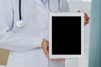 Close-up of doctor holding tablet mock-up Free Photo