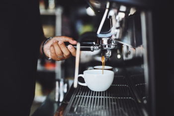 Close-up of Hand Holding Coffee Machine Close-up of Hand Holding Coffee Machine