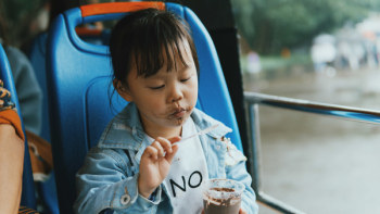 Close-Up Photo of Child Eating Ice Cream Close-Up Photo of Child Eating Ice Cream