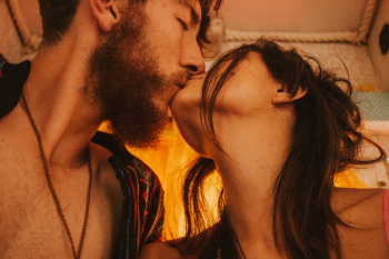 Close-up Photo of Couple Kissing Inside
