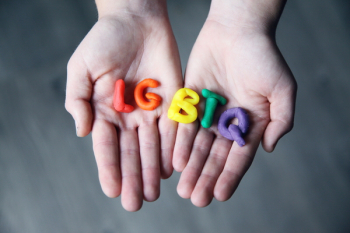 Close-Up Photo of LGBTQ Letters on a Person's Hands Close-Up Photo of LGBTQ Letters on a Person's Hands