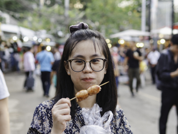 Close-Up Photo of Woman Eating Street Food Close-Up Photo of Woman Eating Street Food