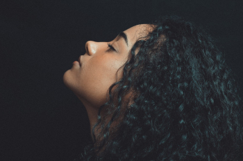 Close-Up Photo of Woman With Curly Hair Close-Up Photo of Woman With Curly Hair