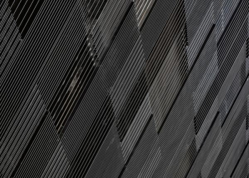 close-up photograph of black concrete wall close-up photograph of black concrete wall