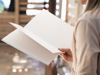 Close-up woman reading a mock-up magazine Free Photo