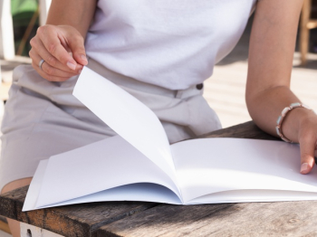 Close-up woman reading a mock-up magazine Free Photo