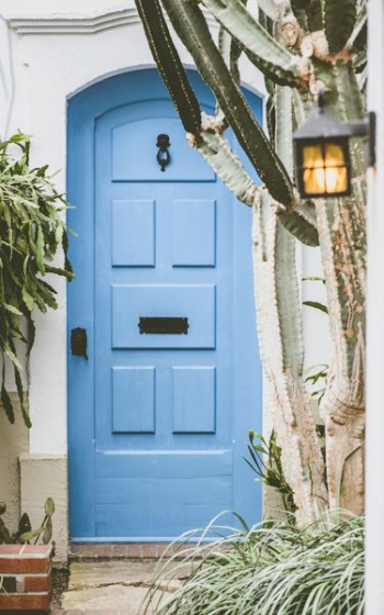 closed blue wooden door closed blue wooden door