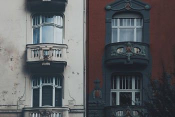 closed glass balcony doors of two buildings closed glass balcony doors of two buildings