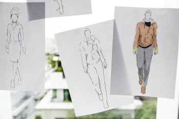 Closeup of fashion sketch design papers on window glass Closeup of fashion sketch design papers on window glass