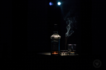 Closeup Photo of Liquor Bottle Against Black Background