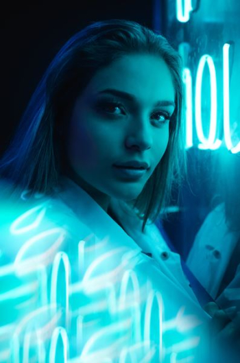 closeup photo of woman near neon light signage