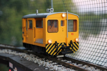 closeup photo of yellow and black train toy closeup photo of yellow and black train toy