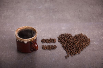 coffee bean beside brown ceramic mug coffee bean beside brown ceramic mug