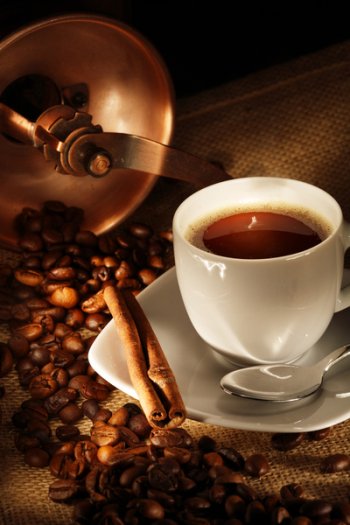 coffee cup with grinder, fresh beans and cookies