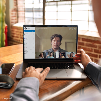 Colleagues having a video conference on a laptop mockup during the cor.. | Free  psd mockup - 2312915