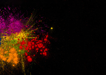 Colorful festival colors  over plain surface with space for text