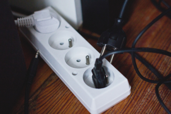Computer cables plugged into an extension cord Computer cables plugged into an extension cord