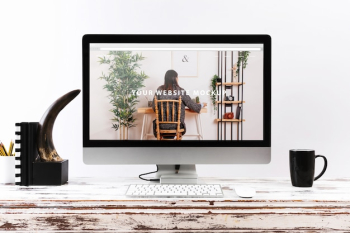 Computer mockup on wooden desk