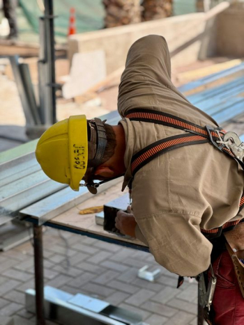 Construction Worker Focusing on Steel Framework Construction Worker Focusing on Steel Framework