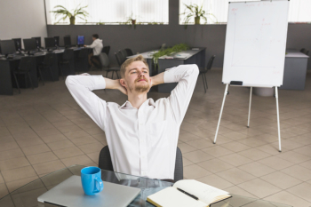 Contemplated businessman sitting in office Contemplated businessman sitting in office