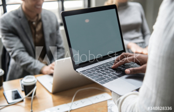 Contemporary office meeting with a laptop Contemporary office meeting with a laptop