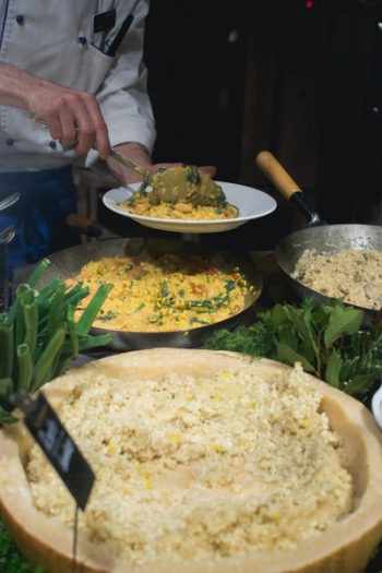 Cook scoops risotto Cook scoops risotto