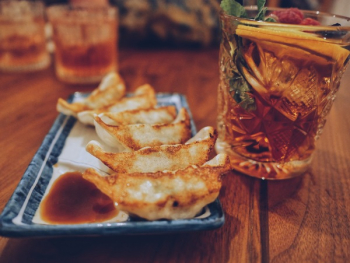 Cooked Breads Platter Beside Drink Cooked Breads Platter Beside Drink