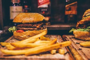cooked French fries and hamburger cooked French fries and hamburger