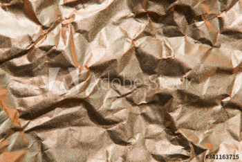 Copper scrunched paper textured background Copper scrunched paper textured background
