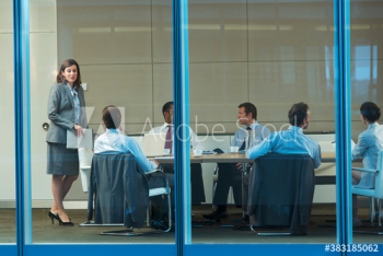 Corporate businesswoman leading conference room meeting Corporate businesswoman leading conference room meeting
