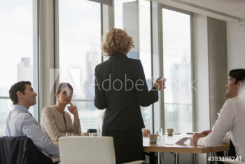 Corporate businesswoman leading conference room meeting Corporate businesswoman leading conference room meeting