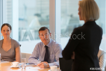 Corporate businesswoman leading conference room meeting Corporate businesswoman leading conference room meeting