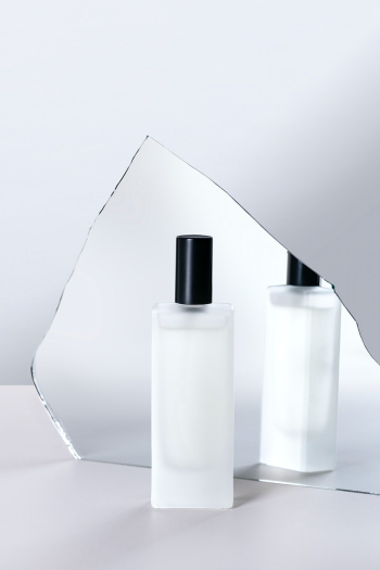 Cosmetic bottle mockup psd in front of mirror… | Free stock illustration | High Resolution graphic