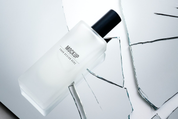 Cosmetic bottle mockup psd on broken mirror | Free stock illustration | High Resolution graphic