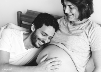 Couple lying in bed together | Free stock photo - 381962