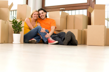 Couple sitting in new home Couple sitting in new home