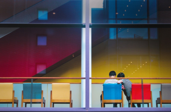 couple sitting on chairs couple sitting on chairs