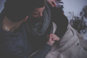 couple with grey blanket couple with grey blanket