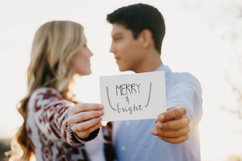 couples holding Merry & Bright card couples holding Merry & Bright card