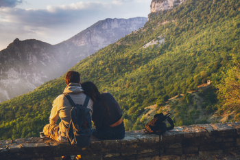 Couples Sitting in While Facing Mountain Couples Sitting in While Facing Mountain